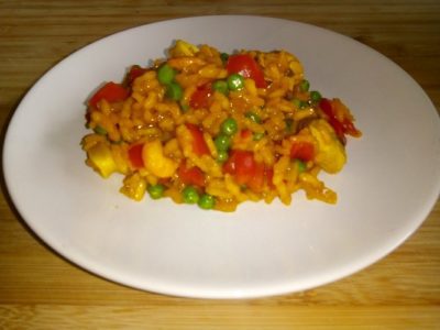 Risotto met zeevruchten, paprika en doperwten