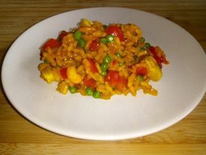 Risotto met zeevruchten, paprika en doperwten
